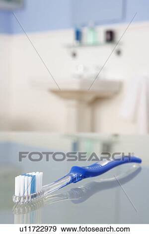 Stock Photo - Toothbrush in bathroom. Fotosearch