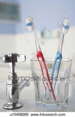 Toothbrushes in bathroom View Large Photo Image Stock Image - Toothbrushes in bathroom. Fotosearch