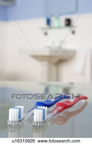 Toothbrushes in bathroom View Large Photo Image Stock Photograph - Toothbrushes in bathroom. Fotosearch
