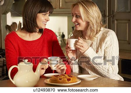 Two Middle Aged Women Enjoying Tea And Cake Together View Large Photo Image Stock Image - Two Middle Aged Women Enjoying Tea And Cake Together. Fotosearch
