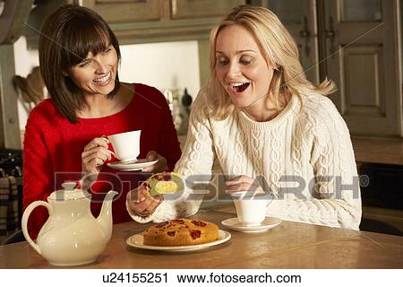 Two Middle Aged Women Enjoying Tea And Cake Together View Large Photo Image Stock Image - Two Middle Aged Women Enjoying Tea And Cake Together. Fotosearch