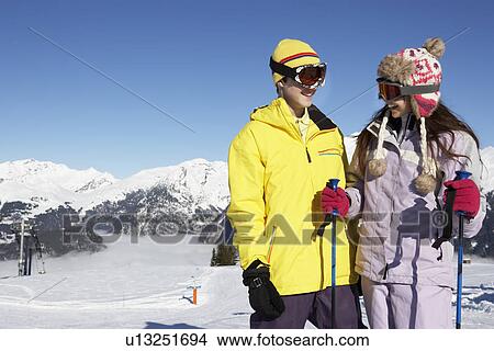 Picture - Two Teenagers On Ski Holiday In Mountains. Fotosearch