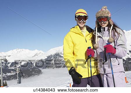 Two Teenagers On Ski Holiday In Mountains View Large Photo Image Stock Image - Two Teenagers On Ski Holiday In Mountains. Fotosearch