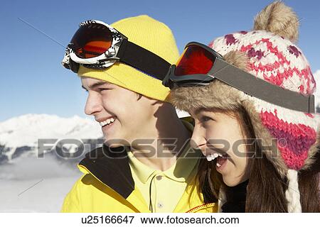 Stock Photo - Two Teenagers On Ski Holiday In Mountains. Fotosearch