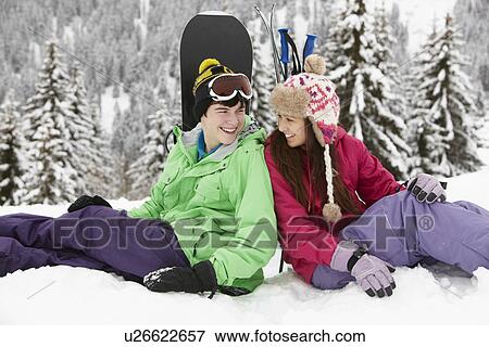 Stock Photo - Two Teenagers On Ski Holiday In Mountains. Fotosearch