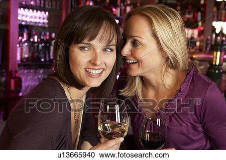 Two Women Enjoying Drink Together In Bar View Large Photo Image Stock Image - Two Women Enjoying Drink Together In Bar. Fotosearch