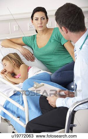 UK Accident and Emergency doctor with mother and child View Large Photo Image Stock Image - UK Accident and Emergency doctor with mother and child. Fotosearch