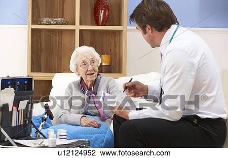 UK GP visiting senior woman at home View Large Photo Image Stock Image - UK GP visiting senior woman at home. Fotosearch