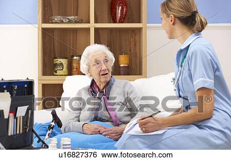 UK nurse visiting senior woman at home View Large Photo Image Stock Photograph - UK nurse visiting senior woman at home. Fotosearch
