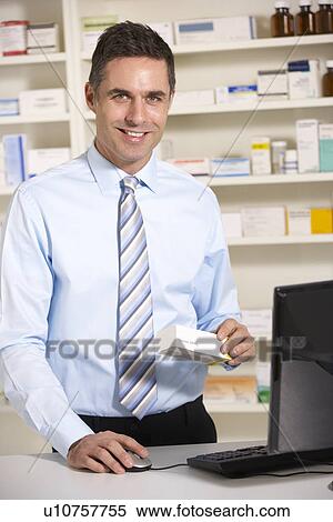 Stock Photography - UK pharmacist at work. Fotosearch