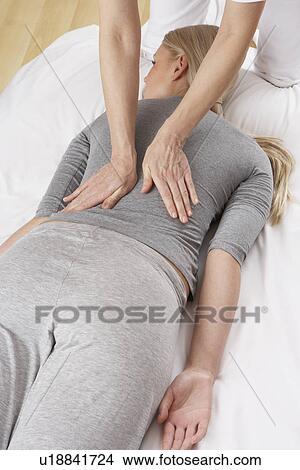 Picture - Woman having Shiatsu massage. Fotosearch