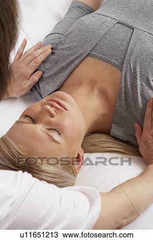 Stock Image - Woman having Shiatsu massage. Fotosearch