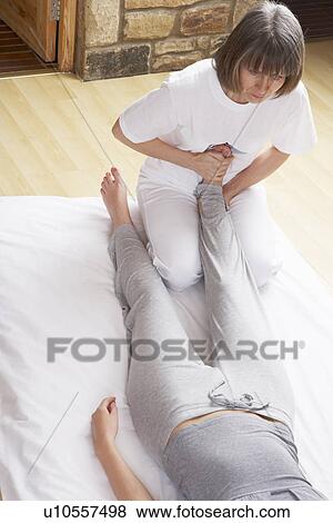 Stock Photo - Woman having Shiatsu massage. Fotosearch