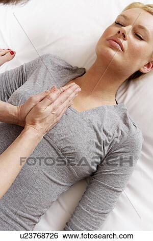 Stock Photograph - Woman having Shiatsu massage. Fotosearch