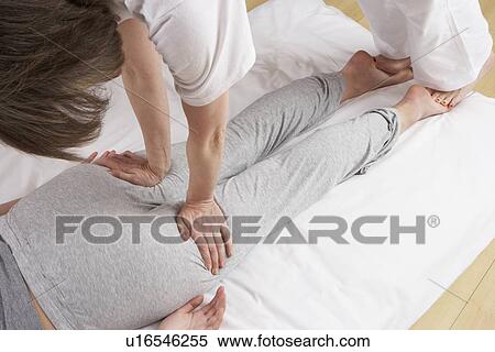 Stock Photography - Woman having Shiatsu massage. Fotosearch