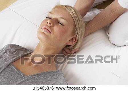 Stock Photograph - Woman having Shiatsu massage to head. Fotosearch