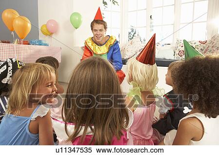 Young children eating jam tarts at birthday party View Large Photo Image Stock Photography - Young children eating jam tarts at birthday party. Fotosearch