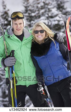 Picture - Young Couple On Ski Holiday In Mountains. Fotosearch