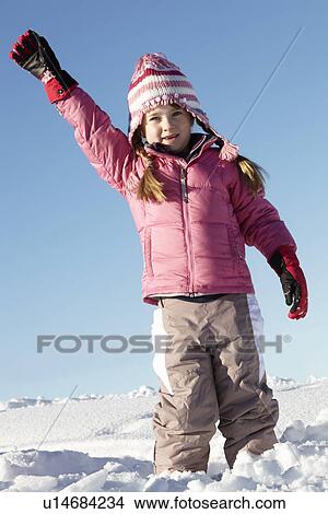 Young Girl Playing In Snow On Holiday In Mountains View Large Photo Image Picture - Young Girl Playing In Snow On Holiday In Mountains. Fotosearch