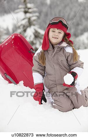 Young Girl Playing In Snow With Sledge On Ski Holiday In Mountains View Large Photo Image Stock Image - Young Girl Playing In Snow With Sledge On Ski Holiday In Mountains. Fotosearch