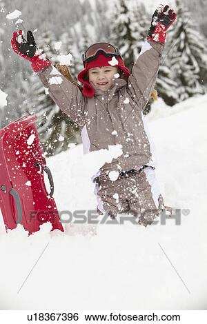 Young Girl Playing In Snow With Sledge On Ski Holiday In Mountains View Large Photo Image Stock Photograph - Young Girl Playing In Snow With Sledge On Ski Holiday In Mountains. Fotosearch