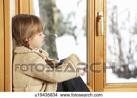 Young Girl Sitting On Window Ledge Looking At Snowy View View Large Photo Image Picture - Young Girl Sitting On Window Ledge Looking At Snowy View. Fotosearch