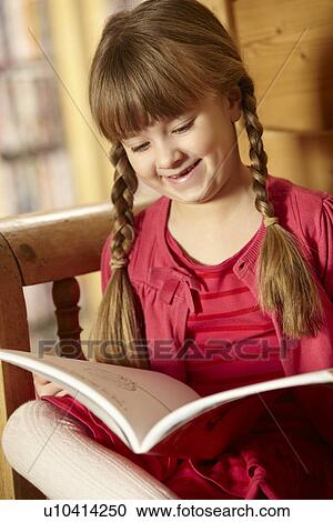Young Girl Sitting On Wooden Seat Reading Book View Large Photo Image Stock Image - Young Girl Sitting On Wooden Seat Reading Book. Fotosearch