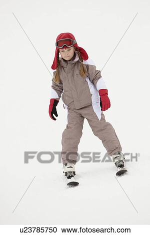 Young Girl Skiing Down Slope On Holiday In Mountains View Large Photo Image Stock Image - Young Girl Skiing Down Slope On Holiday In Mountains. Fotosearch