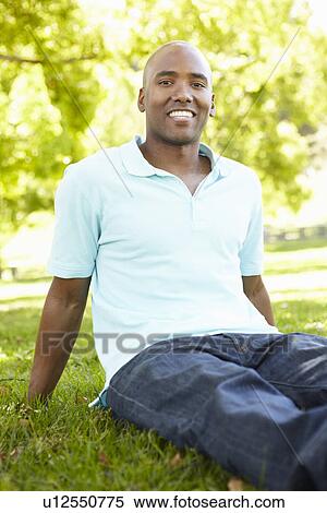 Stock Photography - Young man portrait outdoors. Fotosearch