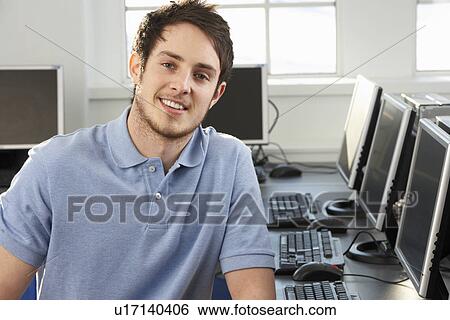Young teacher in empty classroom View Large Photo Image Stock Photograph - Young teacher in empty classroom. Fotosearch