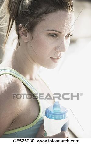 Athletic woman with water bottle View Large Photo Image Stock Image - Athletic woman with water bottle. Fotosearch