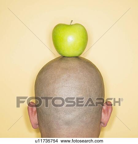 Back view of man with apple on head View Large Photo Image Picture - Back view of man with apple on head. Fotosearch