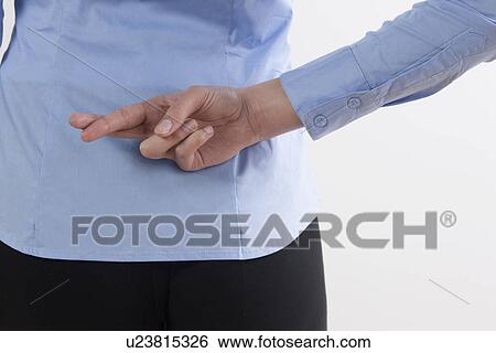 Back view of woman with crossed fingers View Large Photo Image Stock Photograph - Back view of woman with crossed fingers. Fotosearch