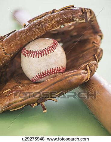 Baseball glove with ball and bat View Large Photo Image Stock Photo - Baseball glove with ball and bat. Fotosearch
