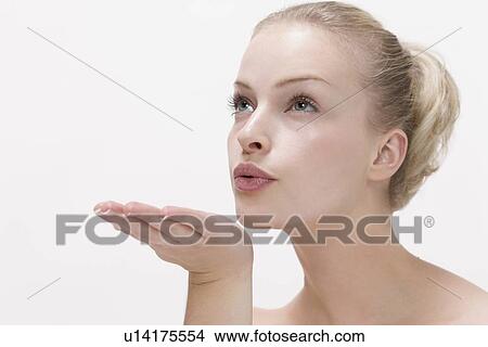 Picture - Beauty portrait of woman blowing kiss. Fotosearch