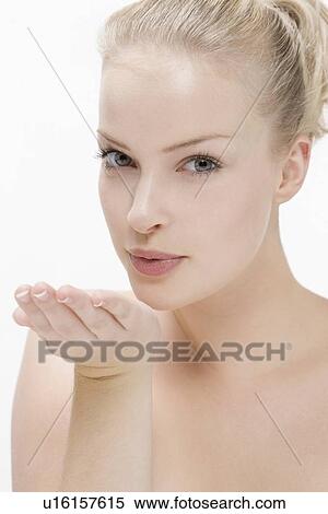 Stock Photography - Beauty portrait of woman blowing kiss. Fotosearch