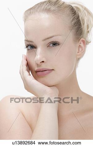 Picture - Beauty portrait of woman with hand on chin. Fotosearch