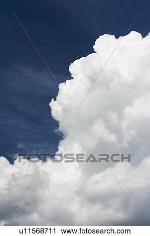 Blue sky with clouds View Large Photo Image Stock Image - Blue sky with clouds. Fotosearch