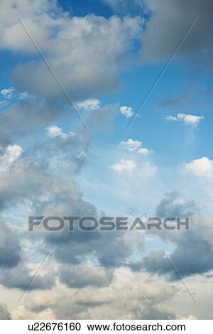 Blue sky with clouds View Large Photo Image Stock Image - Blue sky with clouds. Fotosearch
