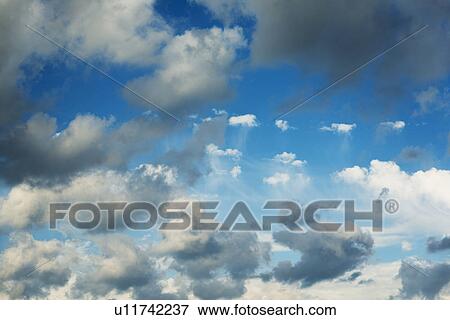Blue sky with clouds View Large Photo Image Stock Photo - Blue sky with clouds. Fotosearch