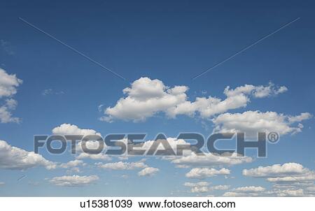 Blue sky with white clouds View Large Photo Image Stock Photo - Blue sky with white clouds. Fotosearch
