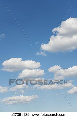 Stock Photo - Blue sky with white clouds. Fotosearch