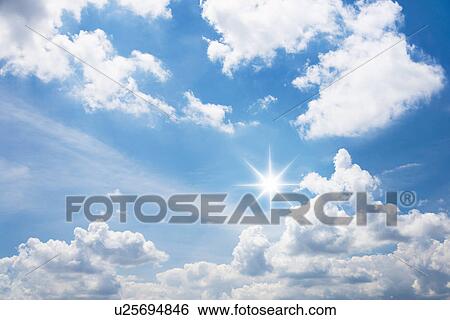 Stock Photograph - Blue sky with white clouds. Fotosearch