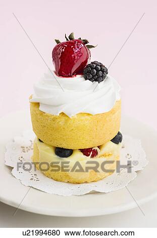 Cake with berries and whipped cream View Large Photo Image Stock Image - Cake with berries and whipped cream. Fotosearch