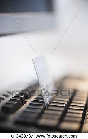 Close-up shot of computer keyboard and credit card View Large Photo Image Stock Photo - Close-up shot of computer keyboard and credit card. Fotosearch