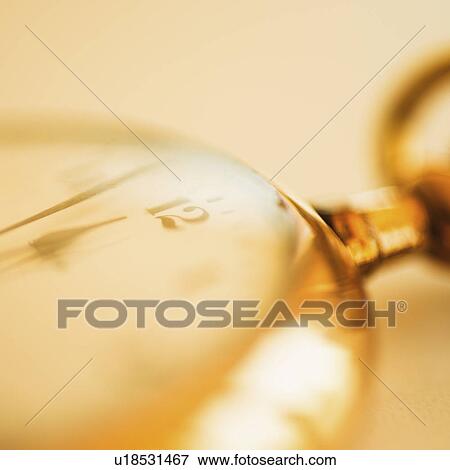 Close-up shot of pocket watch in yellow monochrome View Large Photo Image Stock Photo - Close-up shot of pocket watch in yellow monochrome. Fotosearch