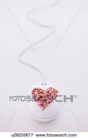 Colorful heart on computer mouse View Large Photo Image Stock Photo - Colorful heart on computer mouse. Fotosearch