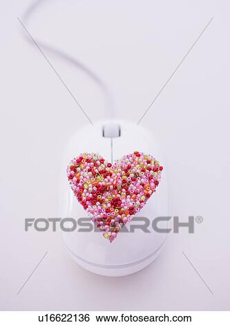 Colorful heart on computer mouse View Large Photo Image Stock Photograph - Colorful heart on computer mouse. Fotosearch