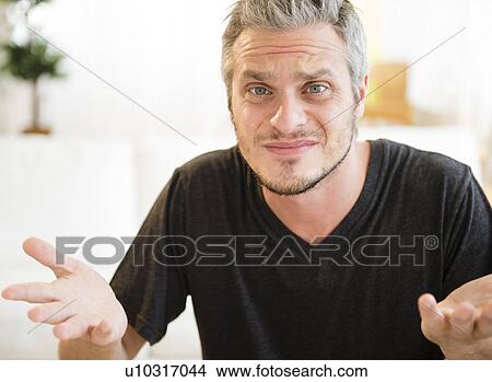 Picture -  Confused mid adult man . Fotosearch