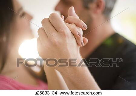 Picture - Couple dancing in bright sunshine. Fotosearch